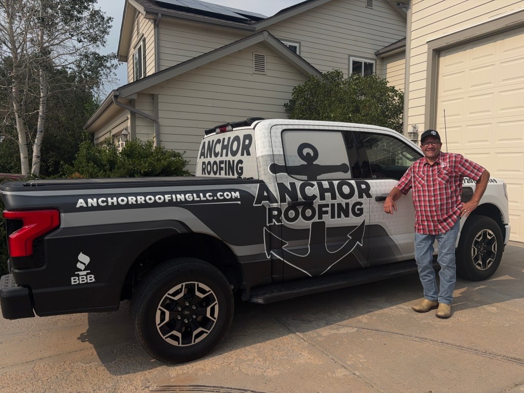 Toby Till with Anchor Roofing & Solar service truck in Colorado